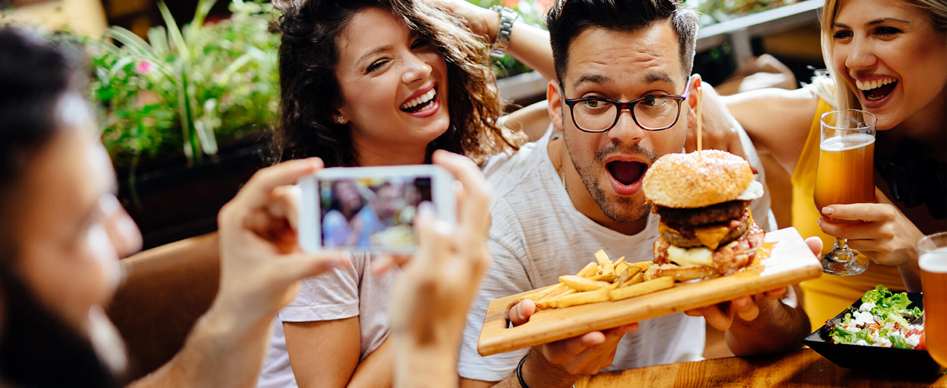 Zoomers taking a photo and enjoying a restaurant experience.