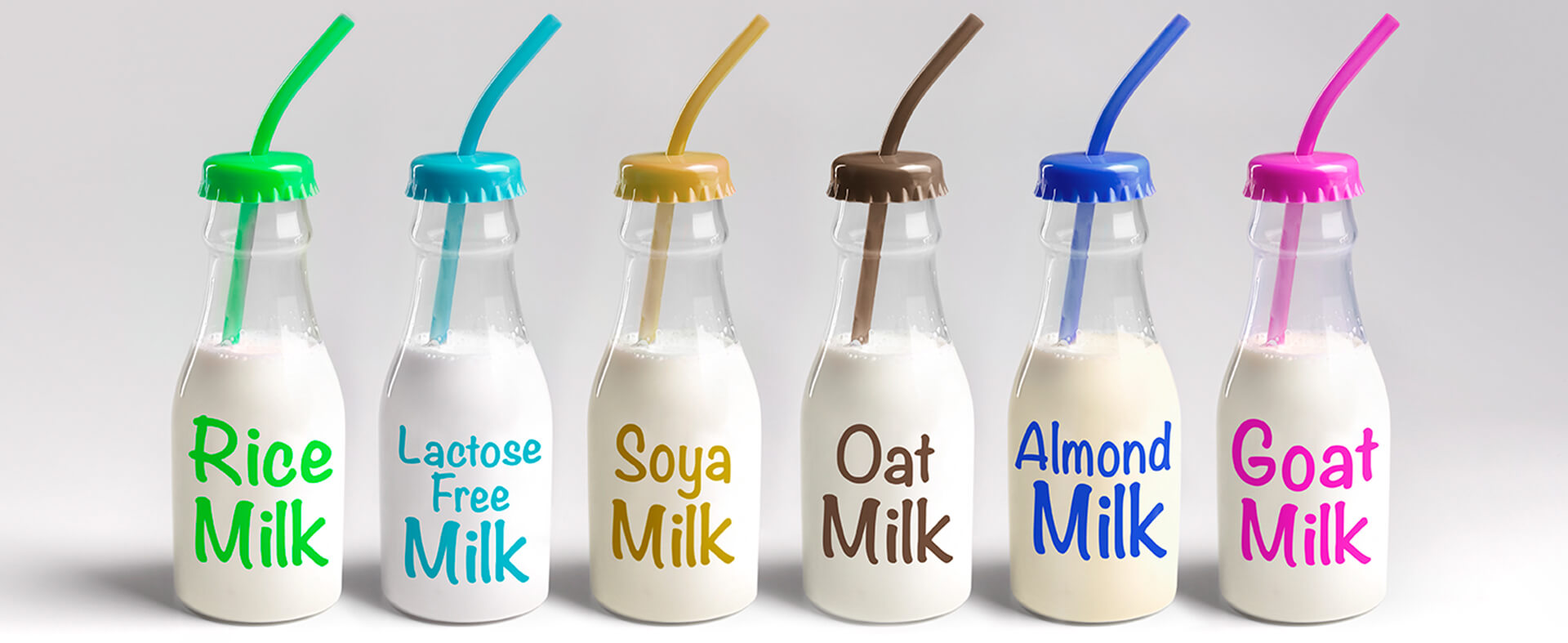 Group shot of a variety of plant-based milk flavors.