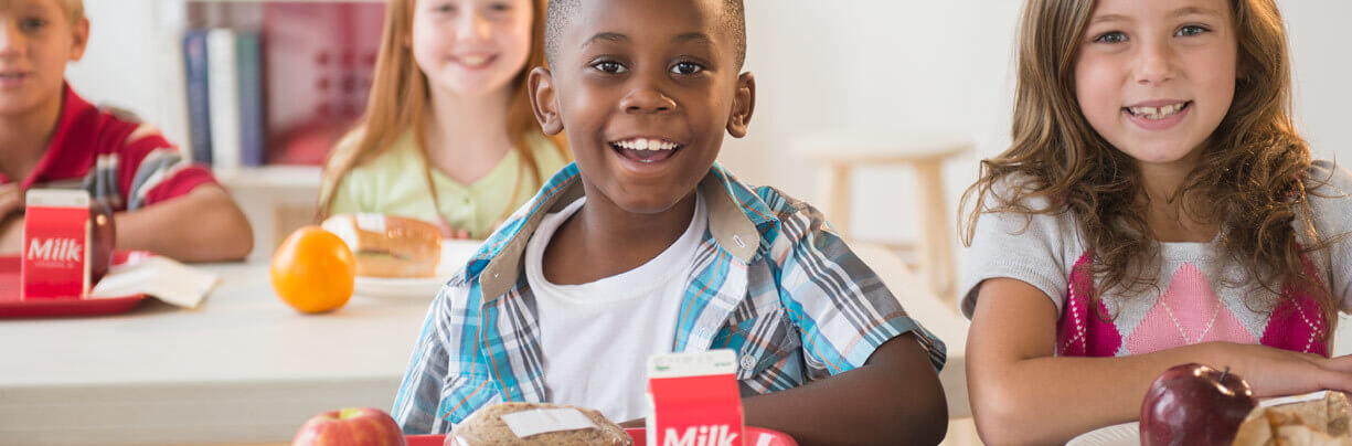 Group of elementary school kids in the lunchroom.