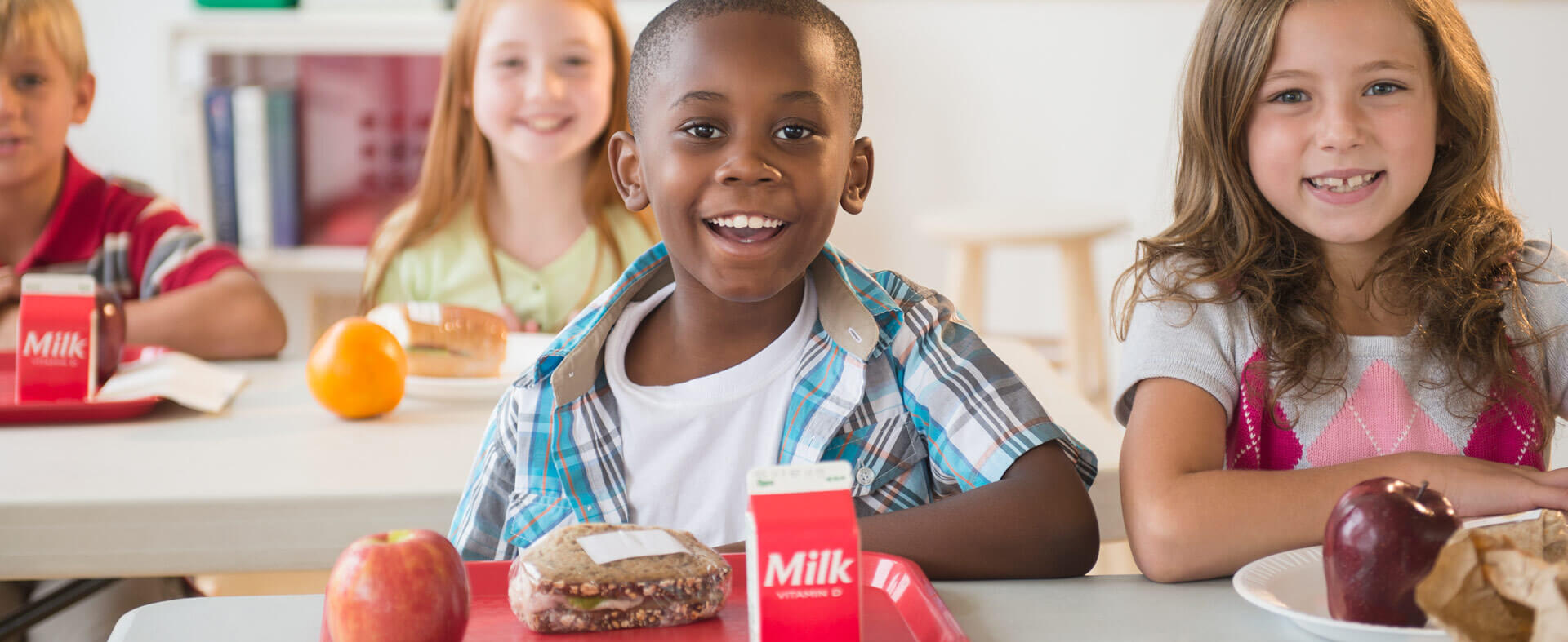 Group of elementary school kids in the lunchroom.