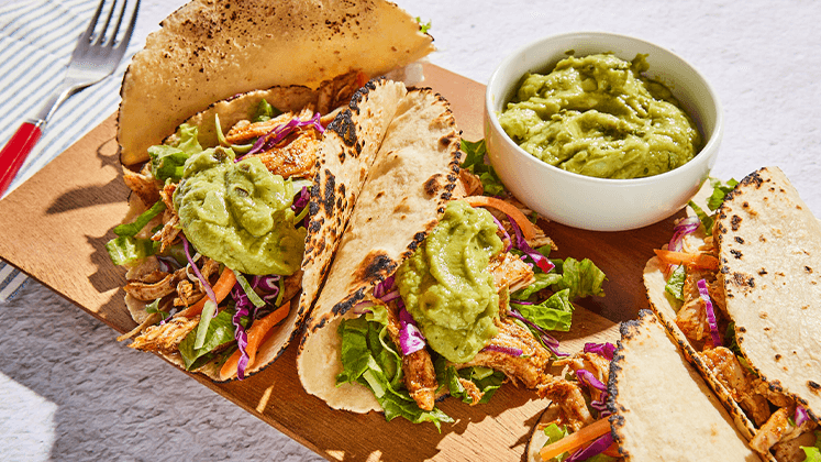 Plate of tacos with Good Foods guacamole.