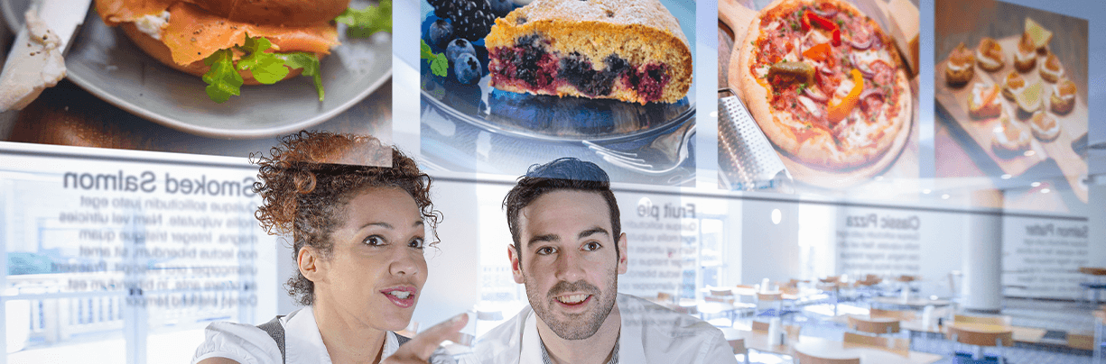 A couple is looking at an AI screen. The screen shows many different foods they can choose from. The choices are based on their personal preferences.