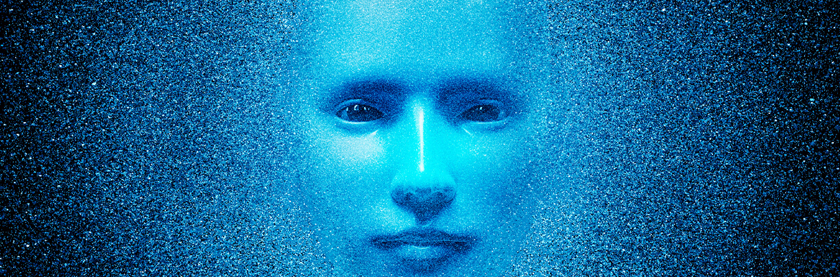 Showing the face of a female created through AI with blue matter exploding around.