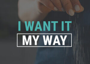 Hand sprinkling ingredients behind a text graphic with the words I Want It My Way.