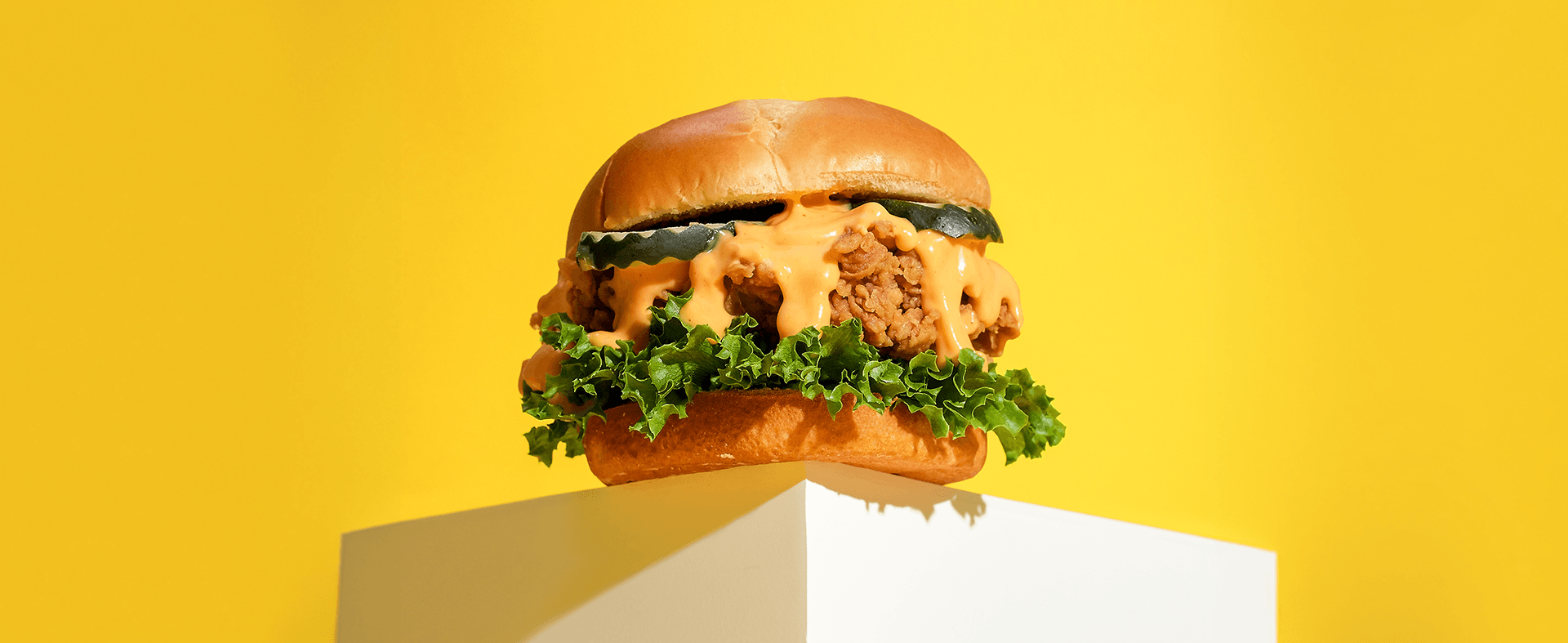 chicken sandwich on a pedestal