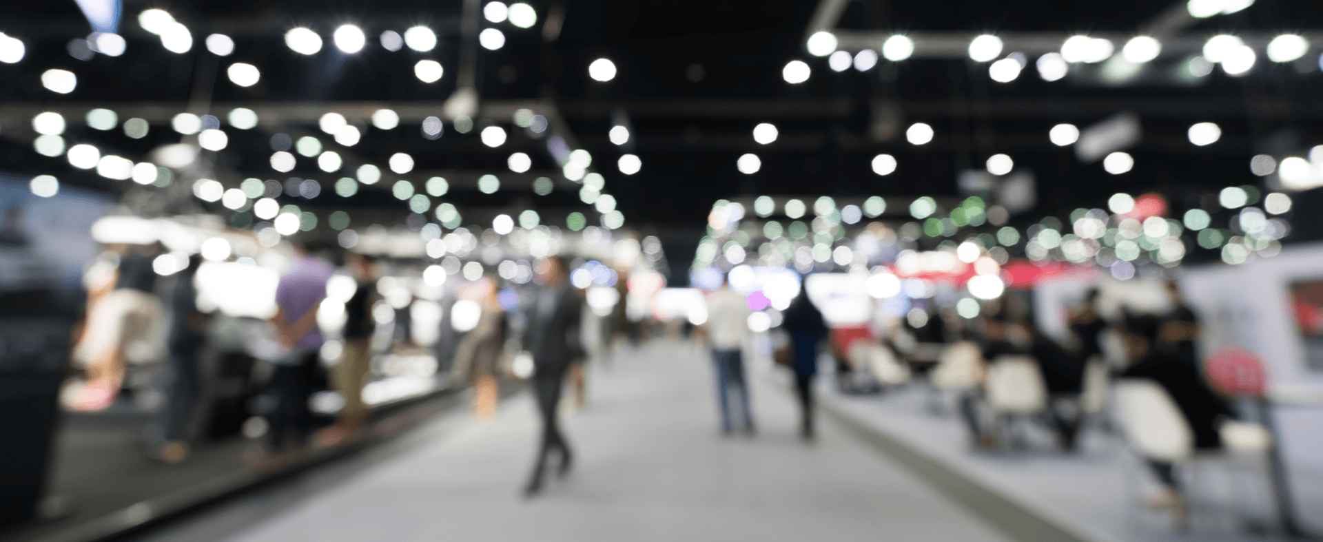 Blurred image of people walking between booths at the National Restaurant Association Show