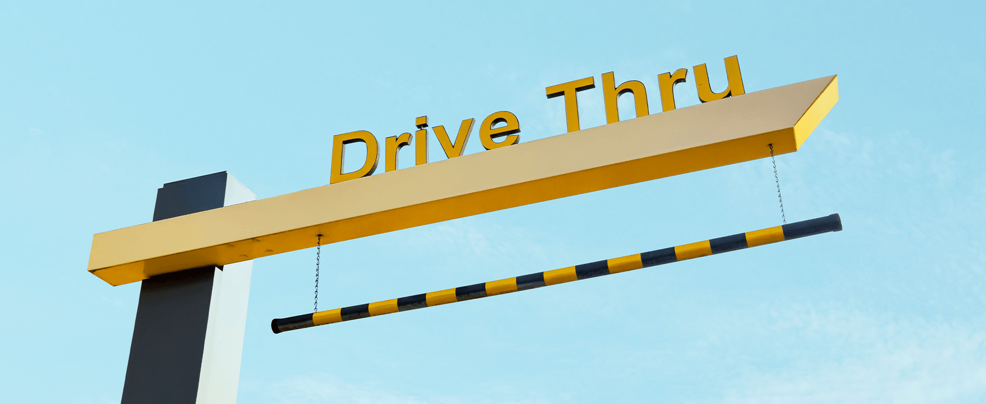 A wide-angle view of a McDonald's drive-thru lane, representing this week’s top foodservice stories about industry reinvention and structural transformation.